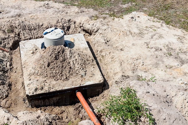 the process for septic tank pumping involves removing the solid waste and sludge from the septic tank using a vacuum truck